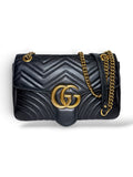 Thrift Mint black quilted leather Gucci Marmont shoulder bag with antique gold GG hardware and sliding chain strap