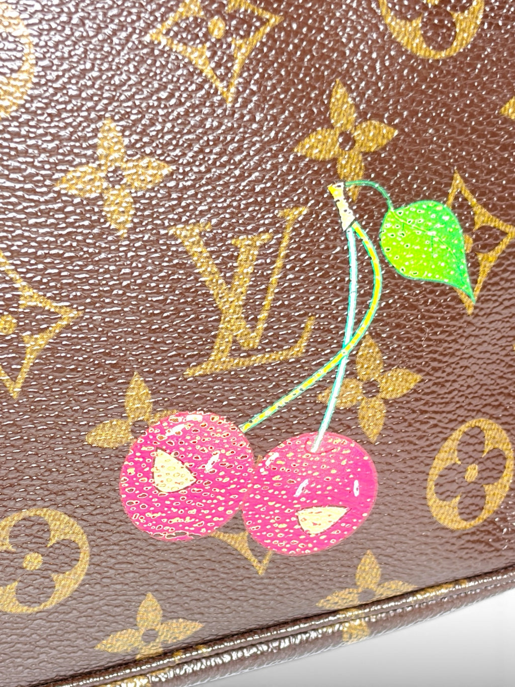 Thrift Mint Louis Vuitton Monogram canvas with playful cherry motif and iconic gold LV logo pattern
