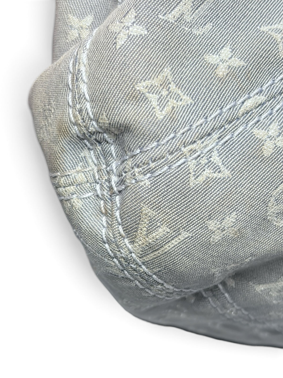 Close-up of Thrift Mint Louis Vuitton grey monogram canvas shoulder bag showing detailed stitching and fabric texture.